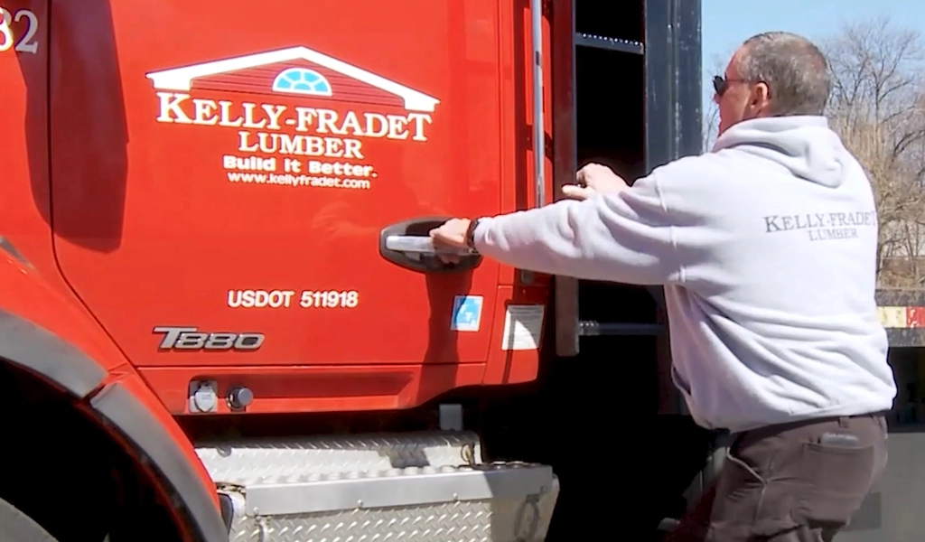 Driver getting into delivery truck