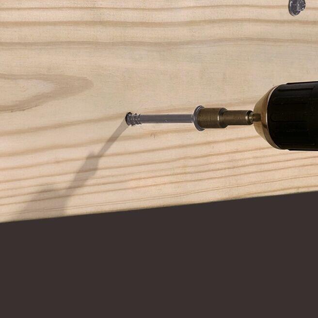Drill screwing into wood