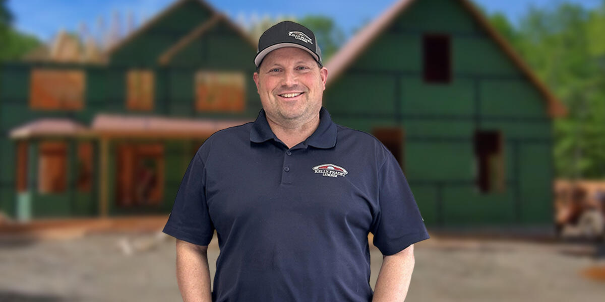 team member standing in front of customer house